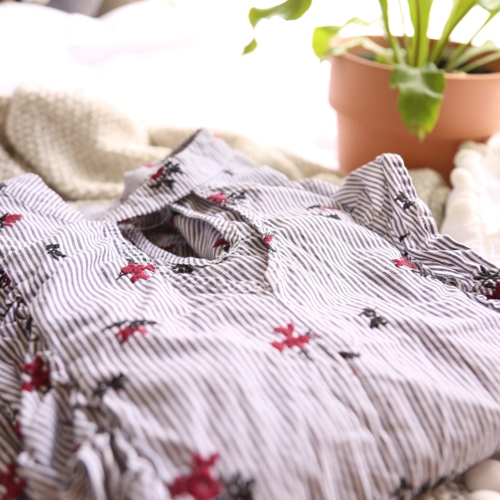 Pinstripe blouse with flower detail